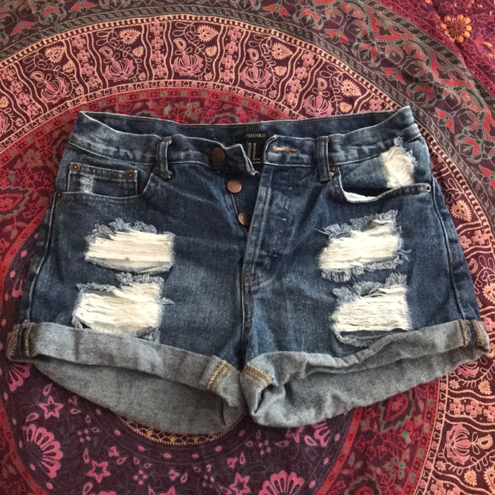 Distressed button up shorts.
